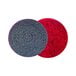 Two red and black SC Johnson Professional Heavy-Duty Scrub Floor Pads with a circular pattern.