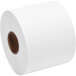 A roll of white paper with a brown circle on the end.