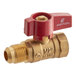 A close-up of a brass gas valve with a red handle.