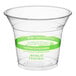 A clear plastic World Centric cold cup with a green label.