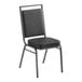 A Lancaster Table & Seating black banquet chair with a metal frame.