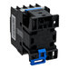 A black and blue electrical component with multiple slots and a spring mechanism, featuring some printed specifications on its surface.