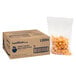 A box of Lamb Weston Sweet Things Mini Tater Puffs with a plastic bag of orange tater tots inside.