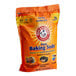 A white and yellow bag of Arm & Hammer baking soda.