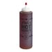 A Mike's Hot Honey extra hot chef bottle with a white cap.