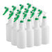 A group of white bottles with green sprayers.