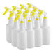 A group of white plastic bottles with yellow sprayers.