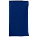 A folded royal blue Intedge cloth napkin.