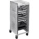 A metal tray cart with a Cambro Camshelving white vinyl cover.