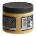 A Black & Bolyard Truffle Brown Butter jar with a black lid.
