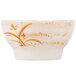 A white bowl with orange orchid designs on a white surface.
