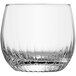 A Schott Zwiesel clear rocks glass with a curved edge.