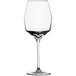 A close-up of a Schott Zwiesel white wine glass with a clear rim and long stem.