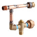 A copper pipe with a Stiebel Eltron mixing valve attached to it.