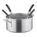 A silver aluminum Vollrath Wear-Ever pasta cooker pot with silicone handles.