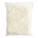 A plastic bag of Del Monte Riced Cauliflower on a white surface.
