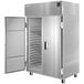 A silver Delfield two section refrigerator with white doors open.