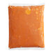 A plastic bag of Campbell's Roasted Red Pepper and Smoked Gouda Bisque.