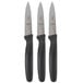 Three Mercer Culinary Millennia paring knives with black handles.