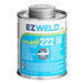 A dark blue can of E-Z Weld PVC Cement with a label.
