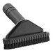 A black Lavex upholstery brush with a handle.