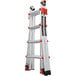 A Little Giant aluminum articulated extendable ladder with red and white letters on it.