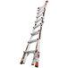 A Little Giant aluminum articulated ladder with red and white accents and orange ratchet levelers.