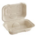 A World Centric compostable fiber hoagie clamshell with a lid.