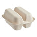 A white World Centric compostable fiber taco clamshell with two compartments containing food.