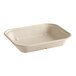 A World Centric white compostable fiber container with a lid.