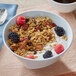 A bowl of Bear Naked granola with yogurt and berries.