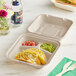 World Centric 3-compartment compostable fiber clamshell with tacos and guacamole.