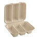 A white World Centric compostable fiber taco clamshell with three compartments.