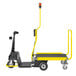 A yellow Amigo Dex Pro motorized carrier with affixed trailer and black wheels.