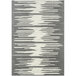 A grey and white abstract geometric area rug with jagged lines.