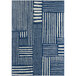 An Abani Casa Collection navy area rug with white geometric patterns.