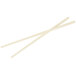 A pair of Town ivory plastic chopsticks on a white background.