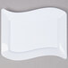 A white Fineline plastic dessert plate with a curved edge.