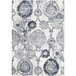 A cream rug with a blue and white distressed medallion pattern.