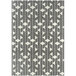 A cream and grey rectangular rug with a geometric pattern.