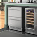 An AvaValley stainless steel wine fridge with two drawers.