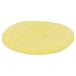 A yellow round Papetti's scrambled egg patty on a white background.