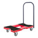 A red Snap-Loc push cart dolly with black wheels.