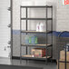 A Lavex Z-Beam metal shelving unit in a garage with containers on the shelves.