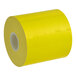 A roll of MAXStick PlusD Canary Diamond adhesive paper with a white background.