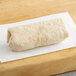 An Alpha Foods Plant-Based Chik'n Fajita Burrito on white paper.