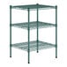 A green metal wire shelf with three shelves.