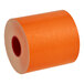 A roll of MAXStick PlusD orange thermal paper with a white liner.