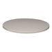 A Perfect Tables 24" round smooth stone gray table top on a table.