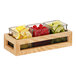 A Cal-Mil wooden condiment organizer with glass jars of lemon and cherries.